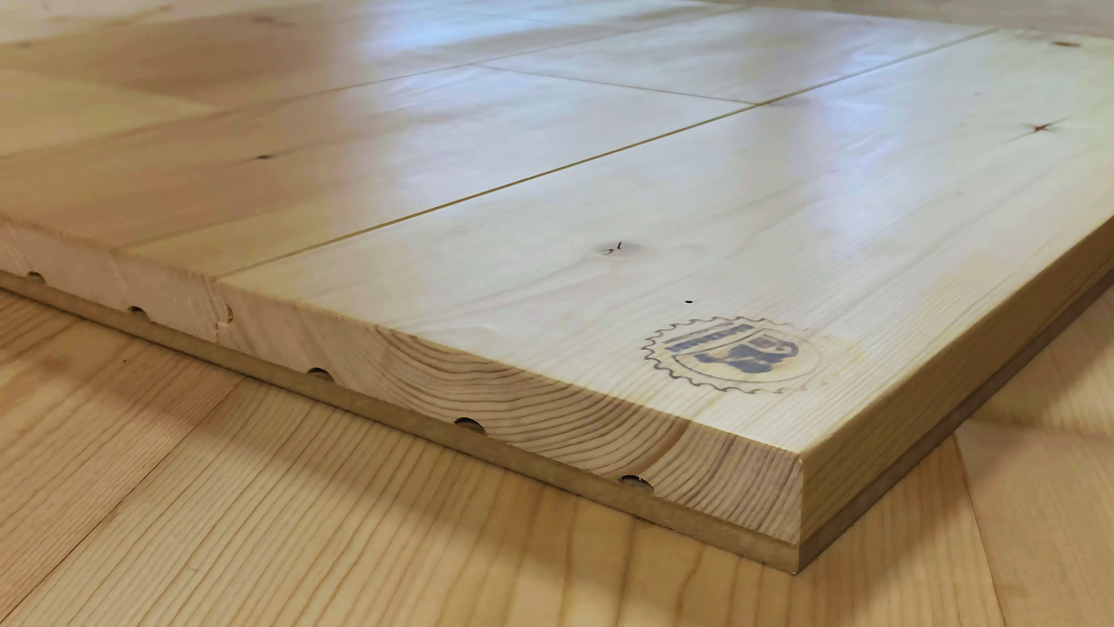 Finished SRL flooring installation showing the batch mark stamped into the board.